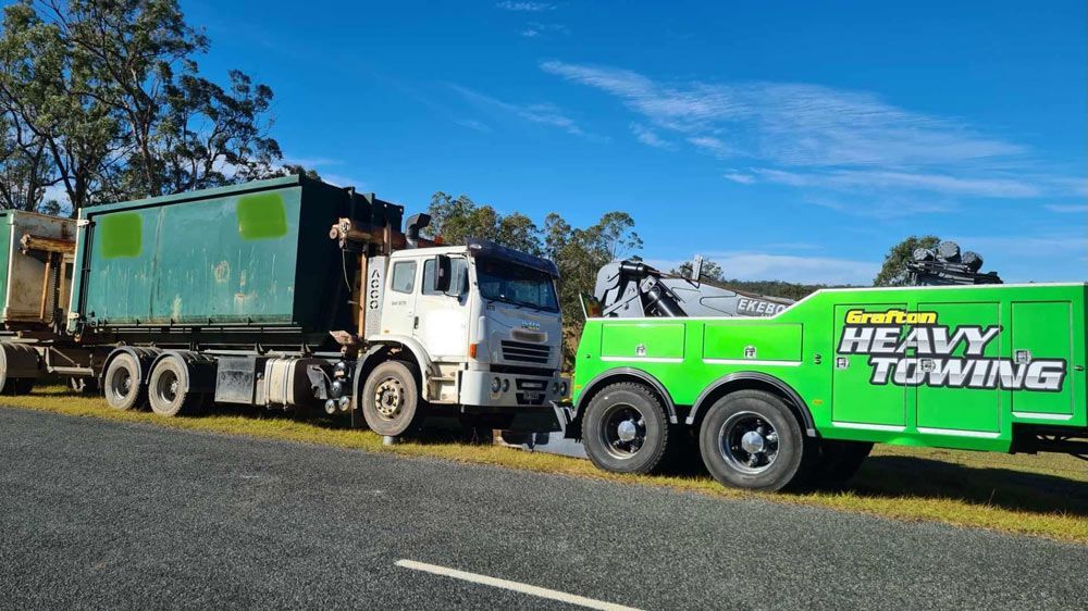 Towing Truck Towing a Heavy Truck loaded with Generator on Highway — Grafton Heavy Towing In Grafton NSW