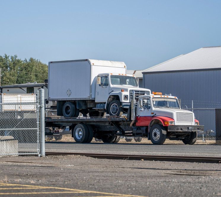 Towing Truck Carry Another Truck With Box Trailer On Flatbed Lifted Trailer — Grafton Heavy Towing In Grafton NSW