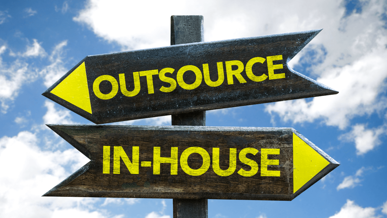 Image of a signpost with the words Outsource and In-House