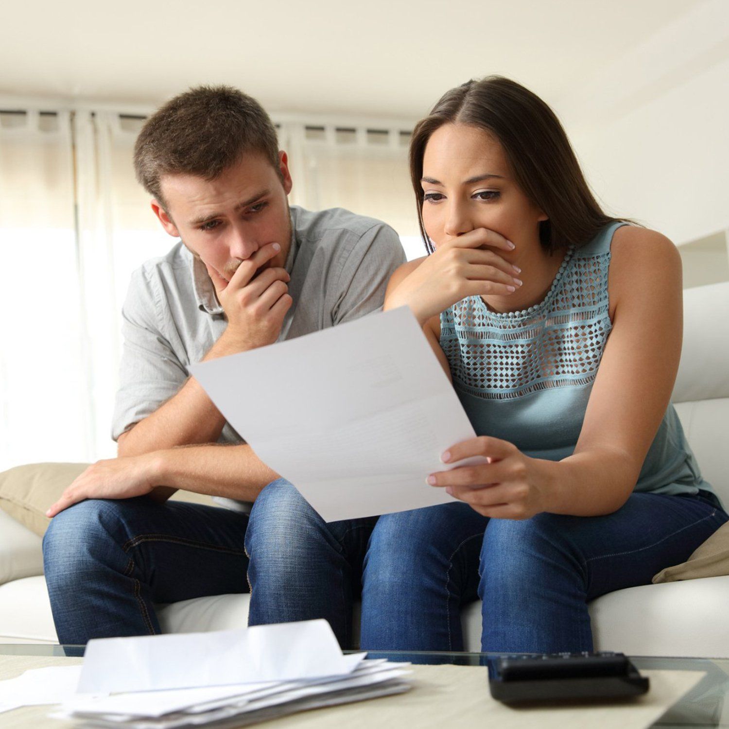 Worried Couple Reading a Letter — Greenville, TN — Woody Smith Attorney at Law