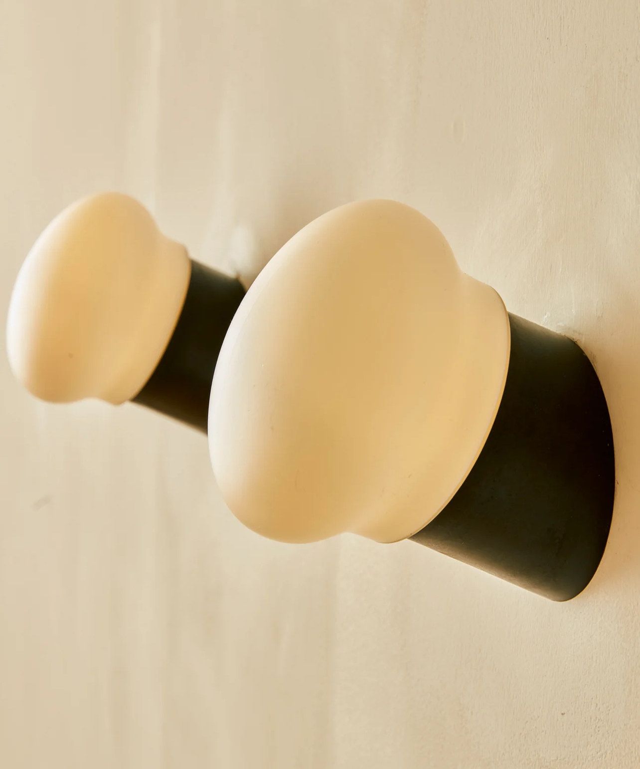 A black and white object is hanging on a wall