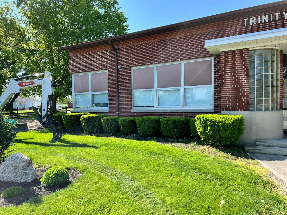 A brick building with the word trinity on it
