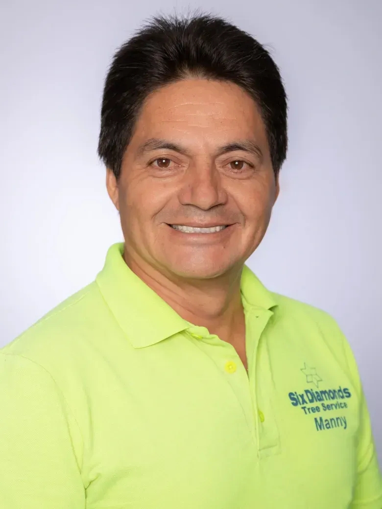 Our Vice President, Manny,  wearing a neon green shirt with the word worth on it