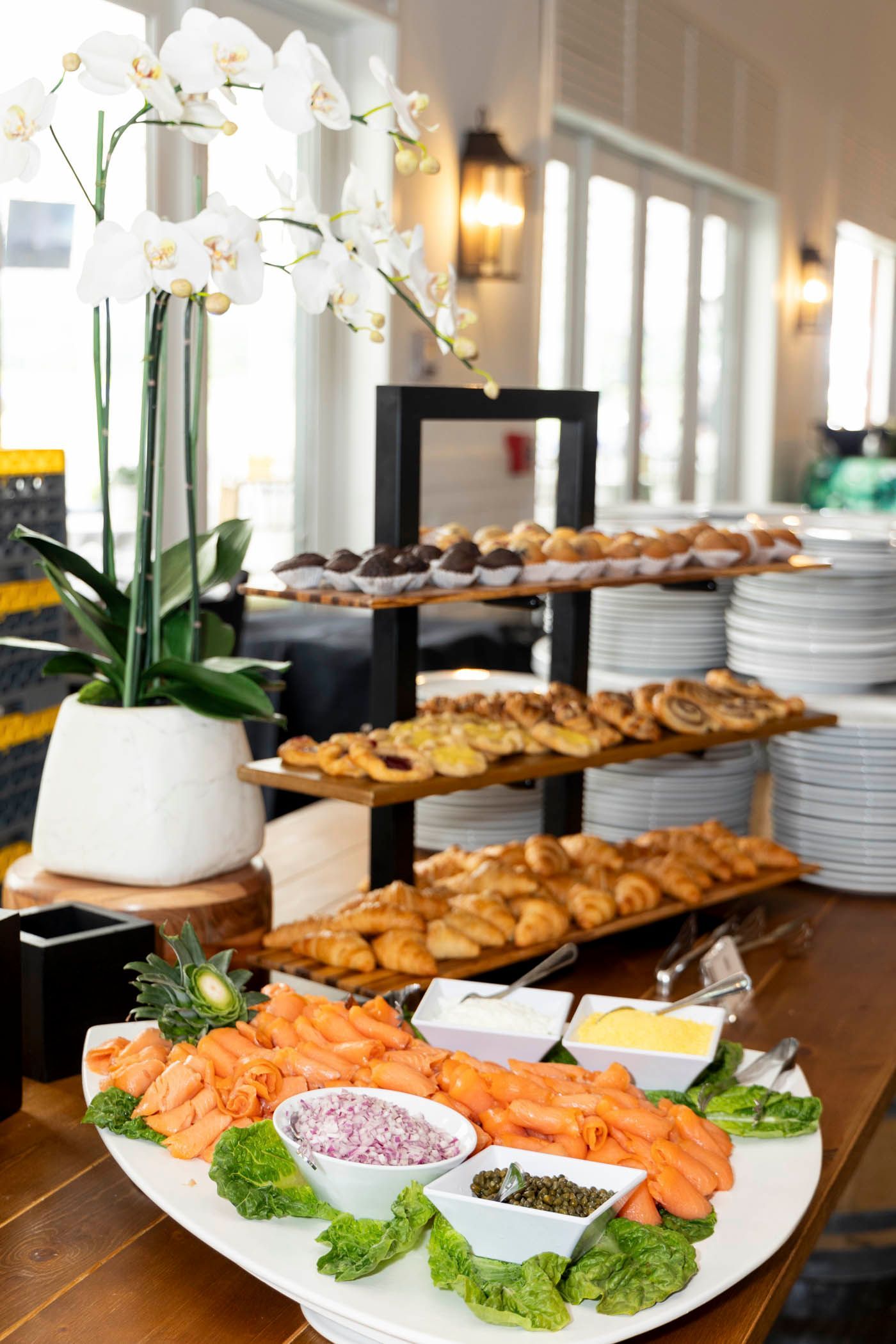 A buffet table with a variety of food on it.