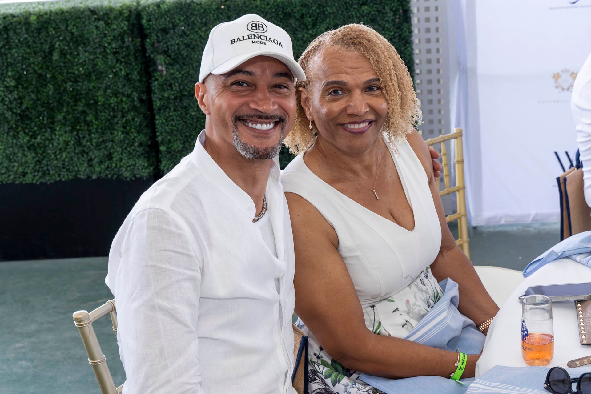A man and a woman are sitting next to each other at a table.