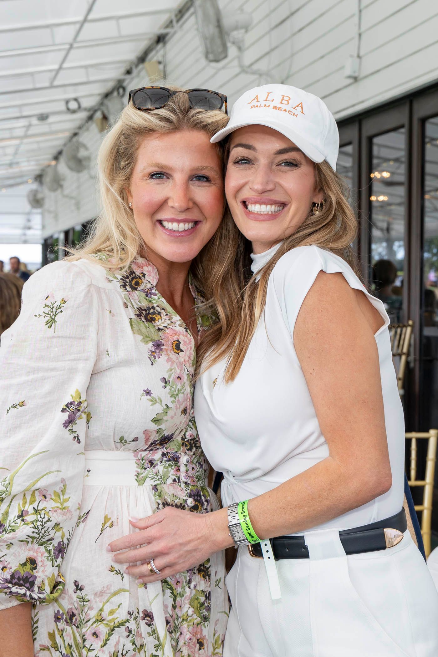 Two women are posing for a picture together and smiling.