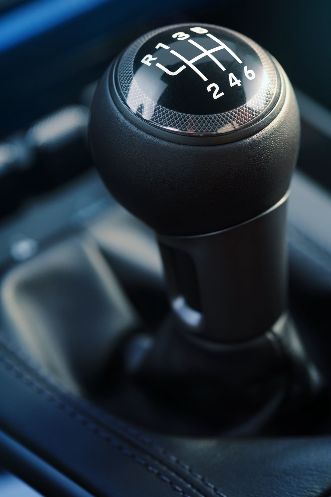 A Close Up Of A Shifter In A Car