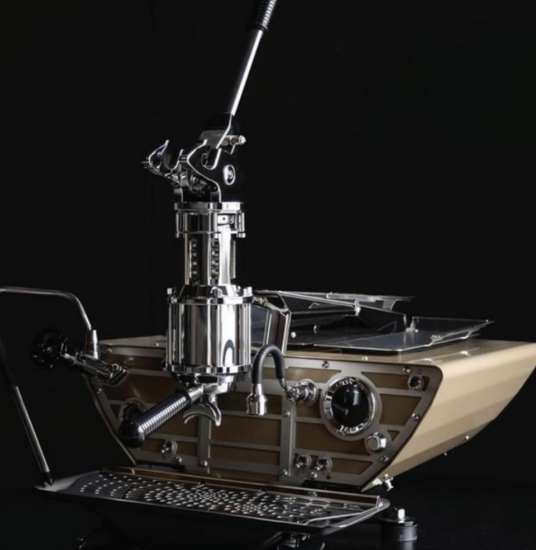 A coffee machine that looks like a boat with a handle