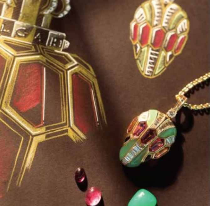 A drawing of a bottle of perfume and a necklace