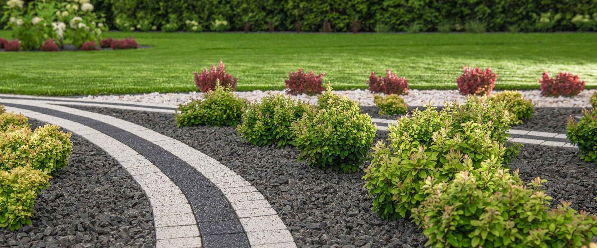 Backyard Garden With Crushed Stone And Pavers