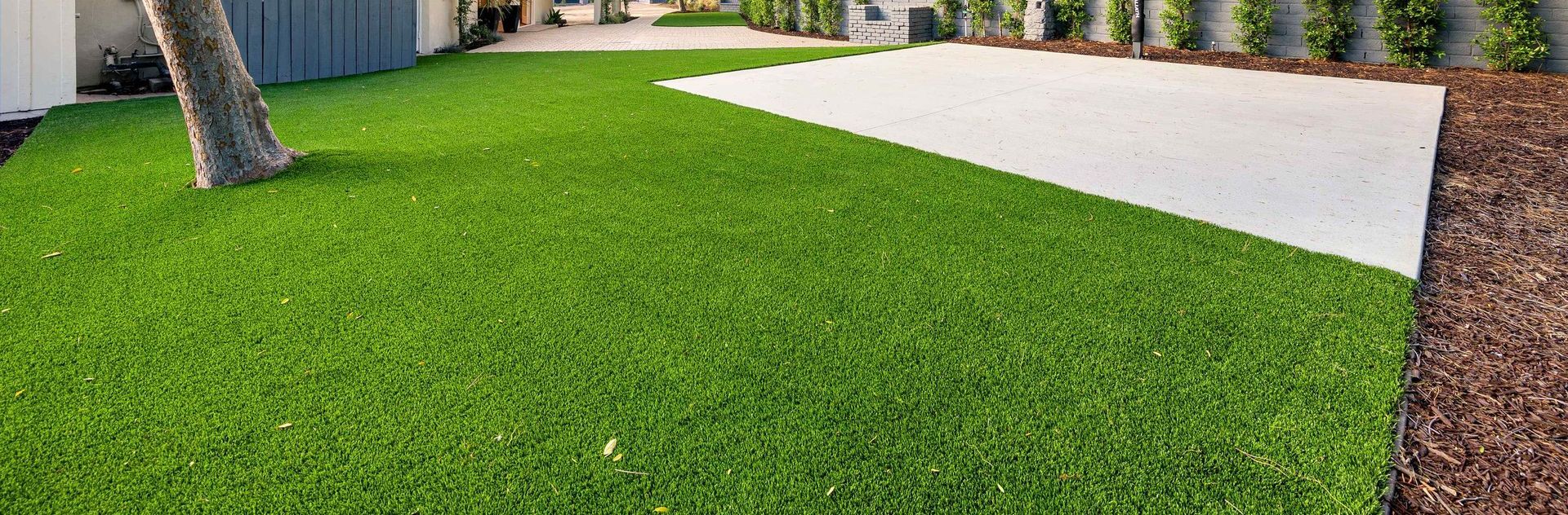 Backyard Of Home With Artificial Turf