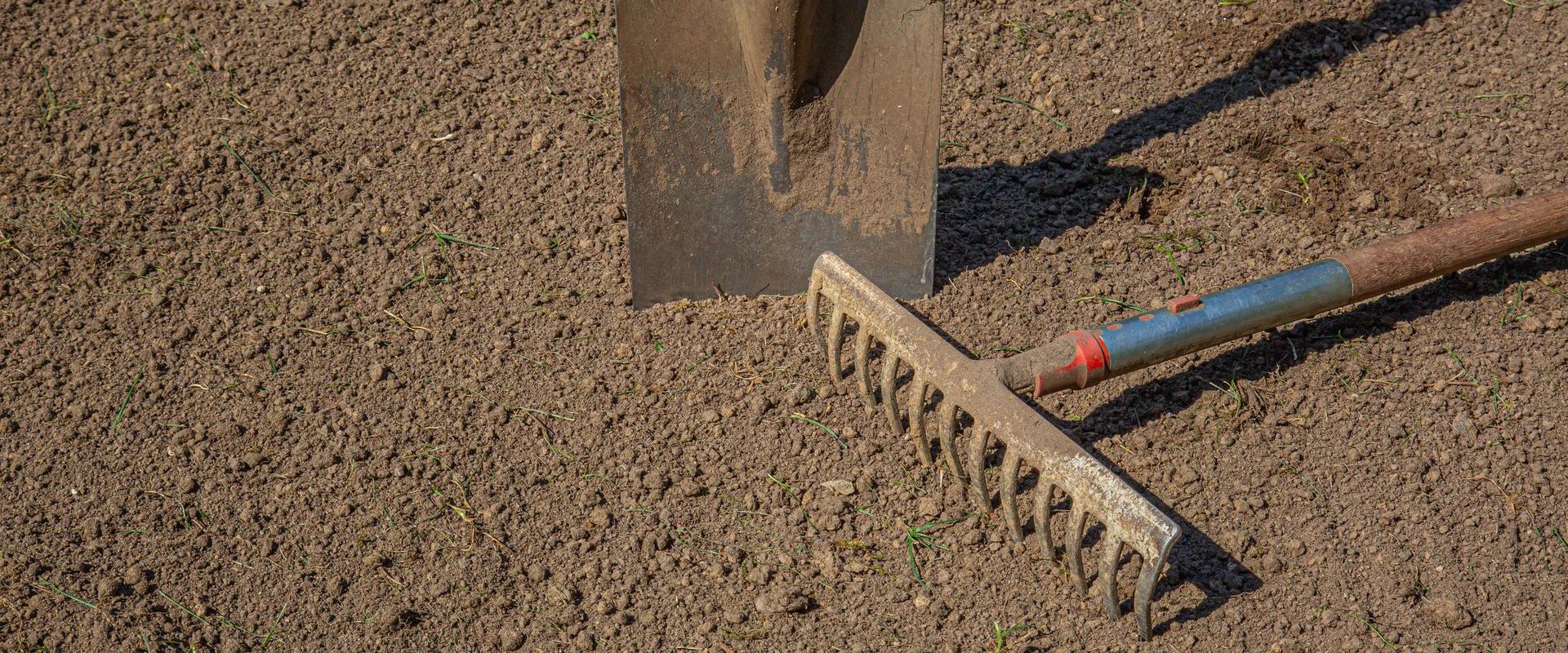 Rake And Shovel Used To Level Base For Artificial Turf