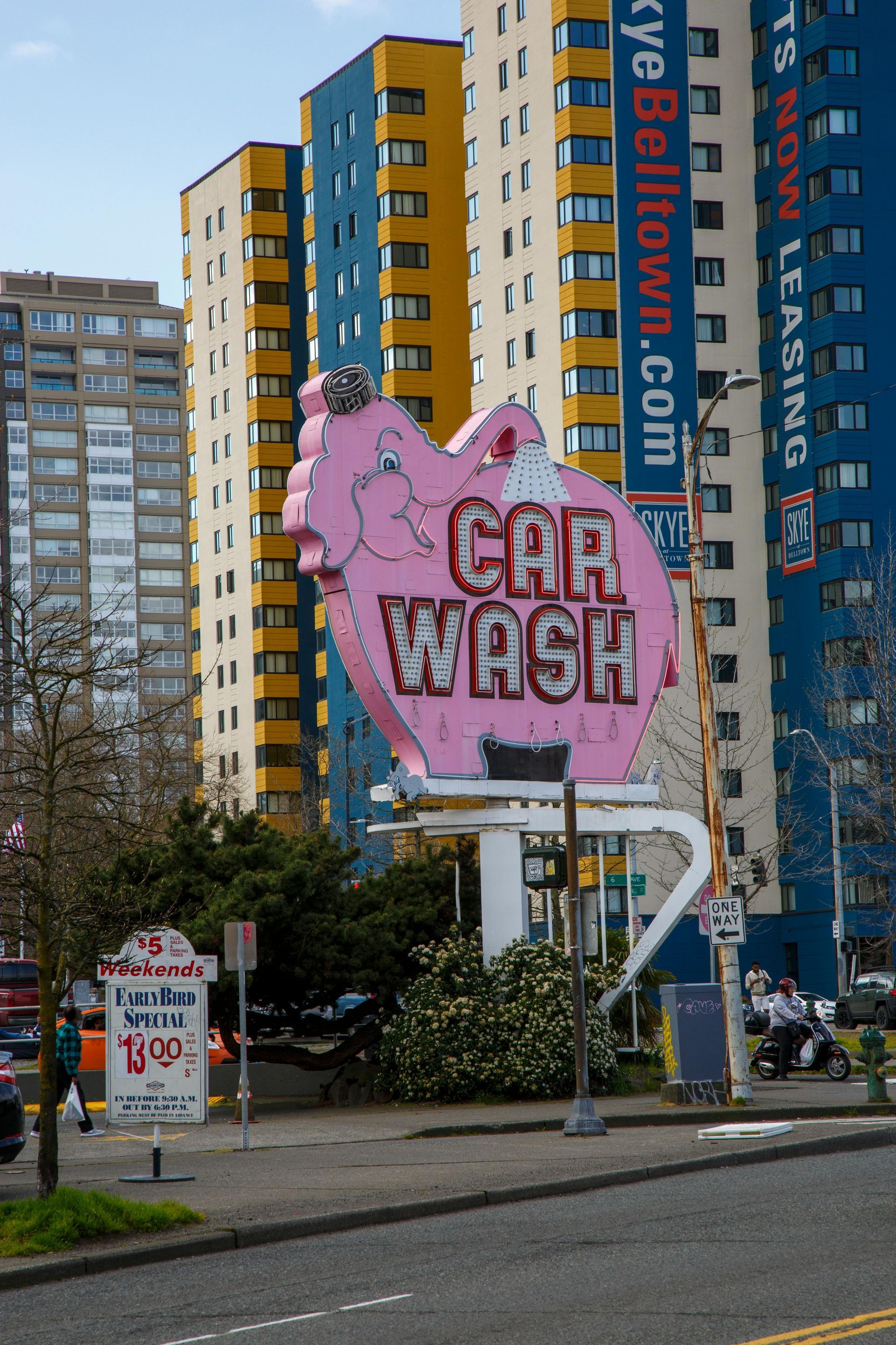 Once called an eyesore, our pink elephant shined through the shade—now a beloved Seattle landmark with a glow that outlasted the critics as beloved part of car wash and neon history.