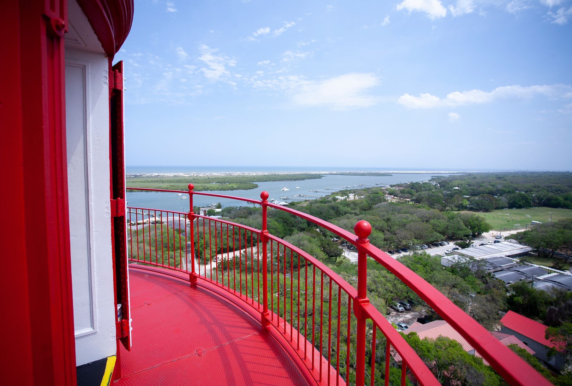 A view of the ocean from the top of a lighthouse.