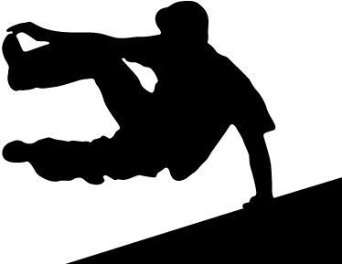 Silhouette of person doing parkour, leaping from angled surface.