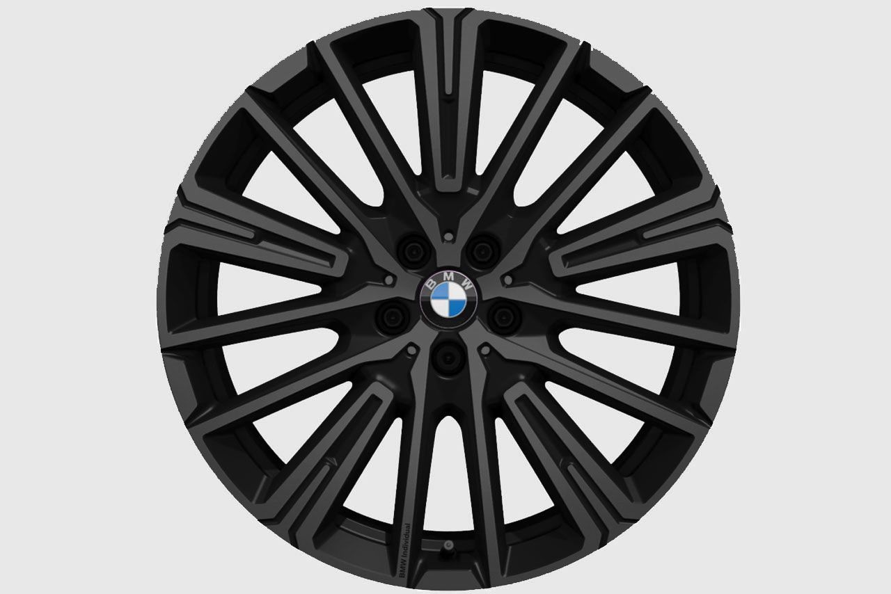 A black bmw wheel on a white background