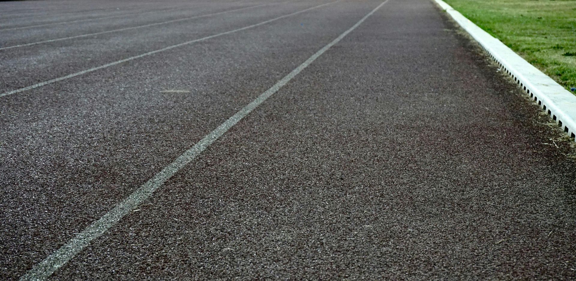 A close up of a track with a white line on it