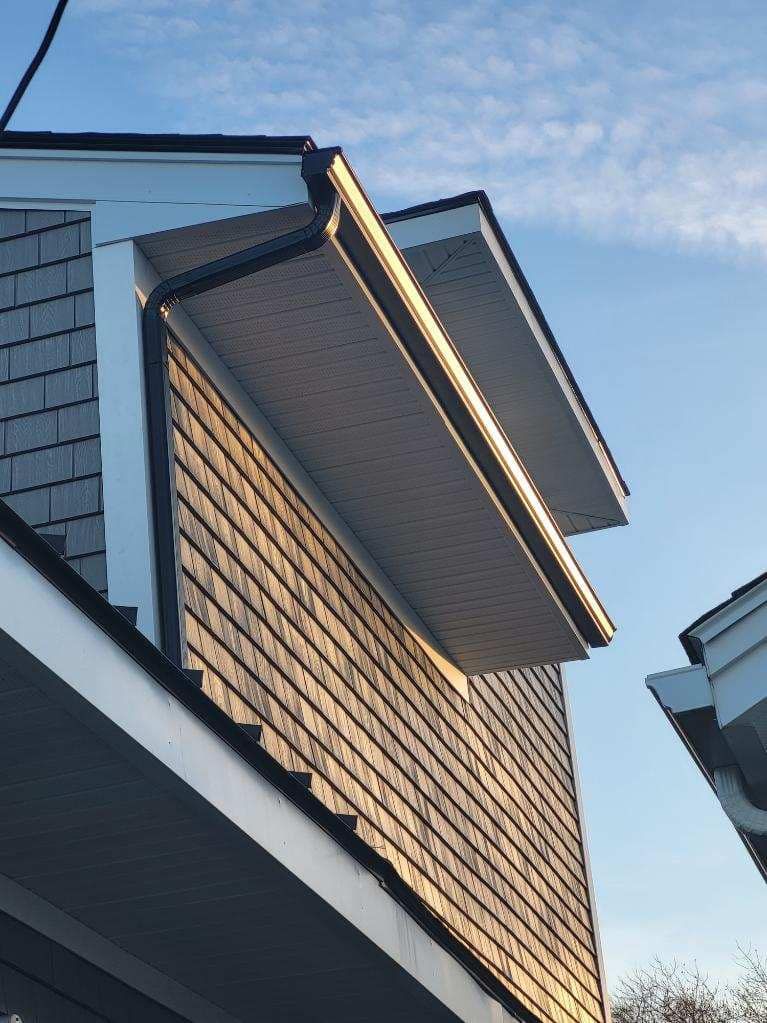A house with a roof that has a gutter on it