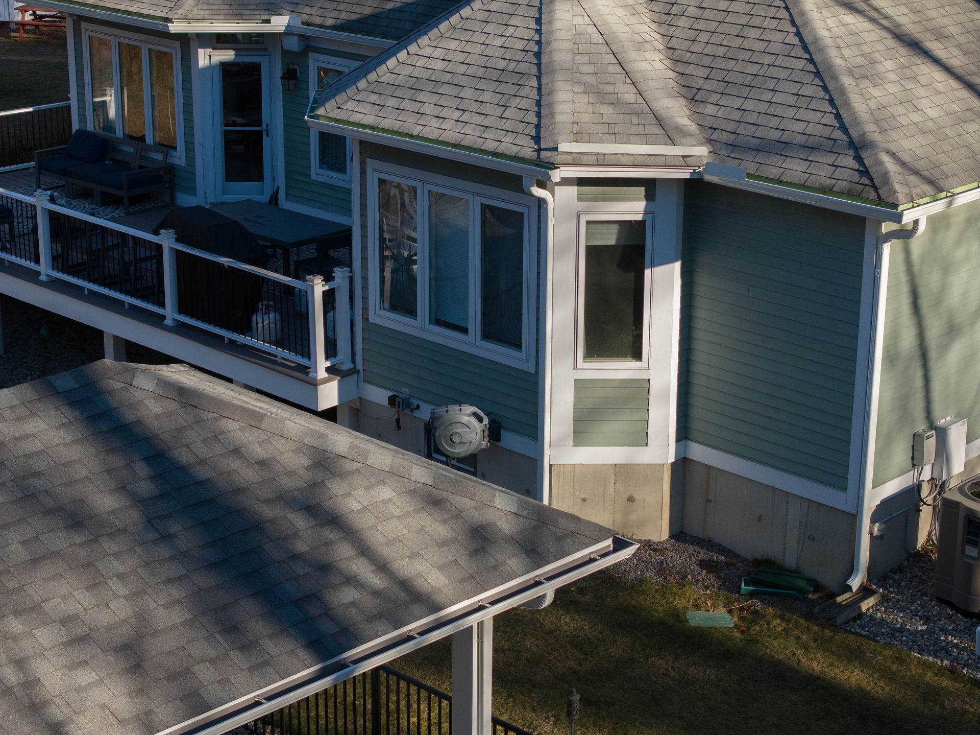 An aerial view of a house with a large deck.