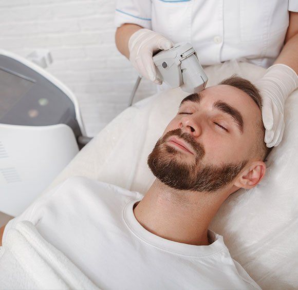 Man Getting Facial Treatment — Kailua,HI — Kailua Dermatology Associates Ltd