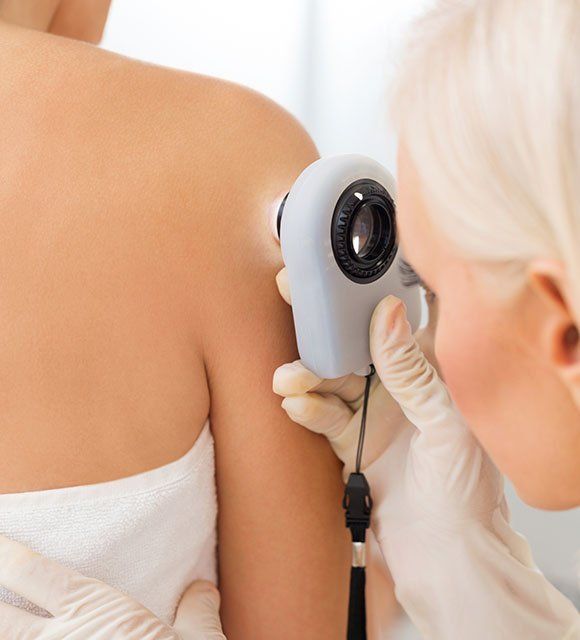 Dermatologist Checking Patient's Skin — Kailua,HI — Kailua Dermatology Associates Ltd