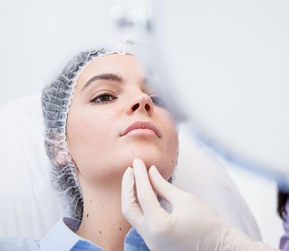 Checking Woman's Face — Kailua,HI — Kailua Dermatology Associates Ltd