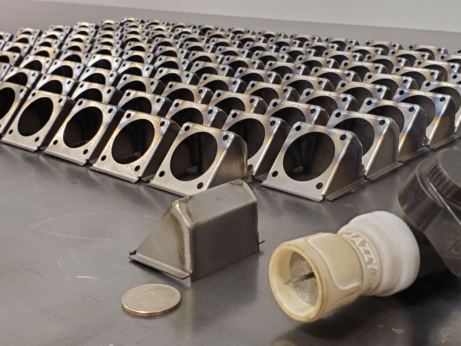 A bunch of metal pieces are sitting on a table