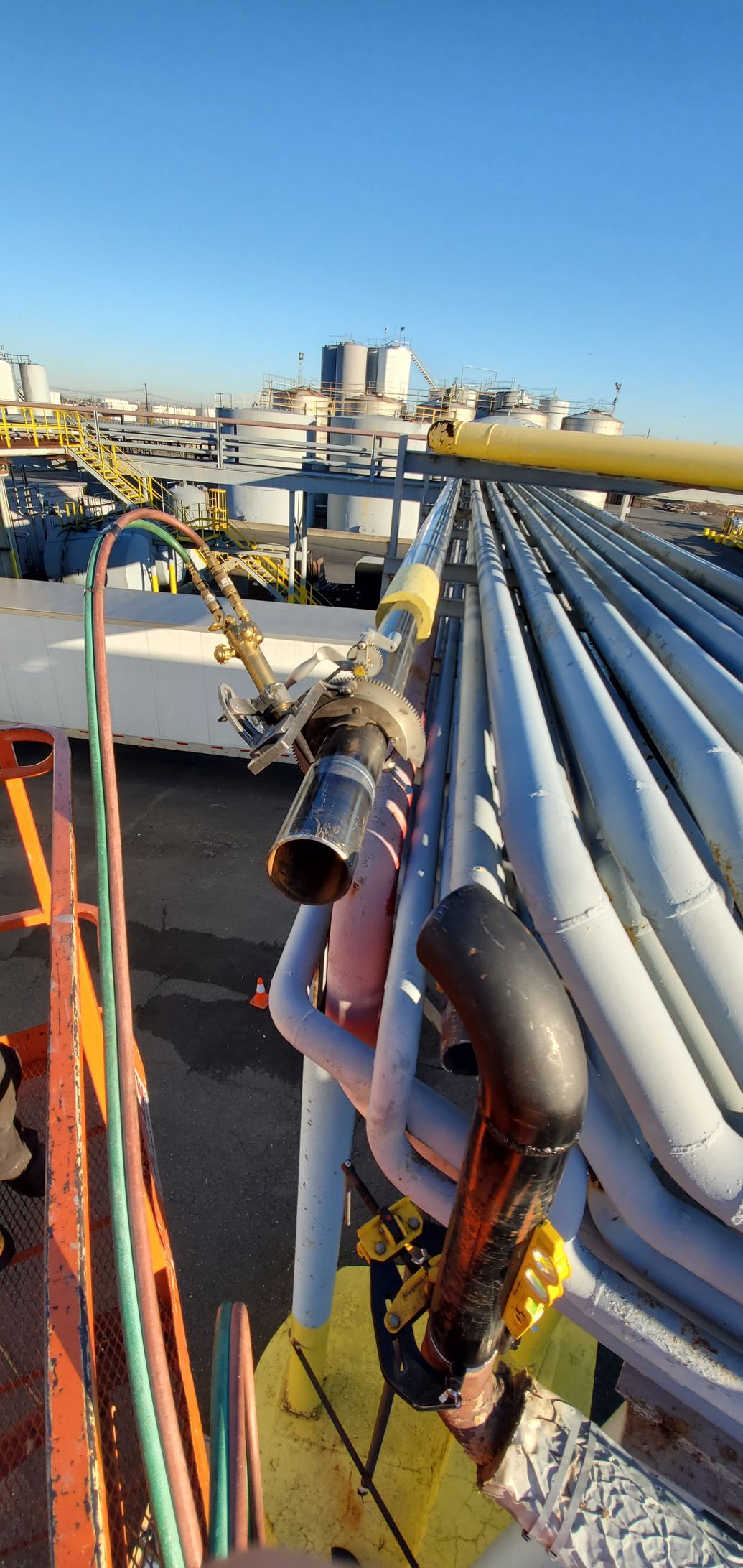 A bunch of pipes are sitting on top of a building.