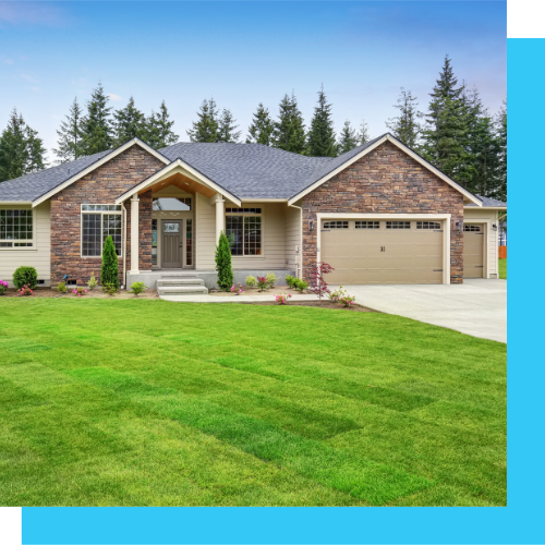 a large house with a lush green lawn in front of it .