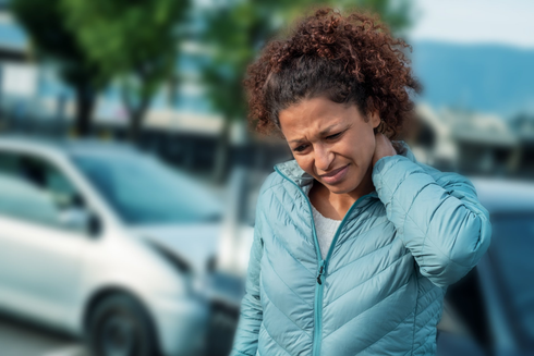 Woman Holding Her Neck After a Car Accident — Whitehall, PA — Richard D. Director Law Offices