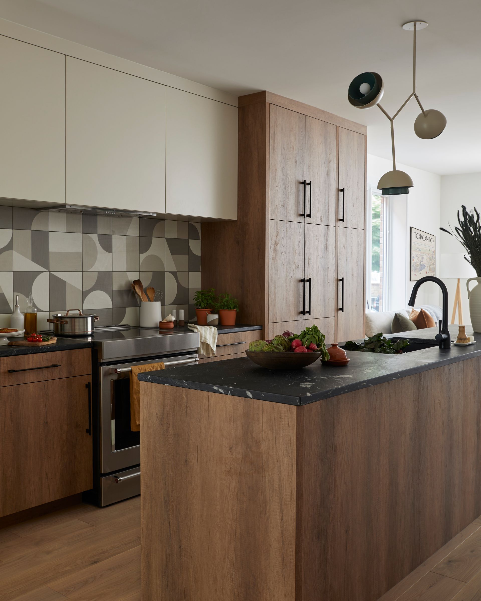 A kitchen with wooden cabinets and a large island