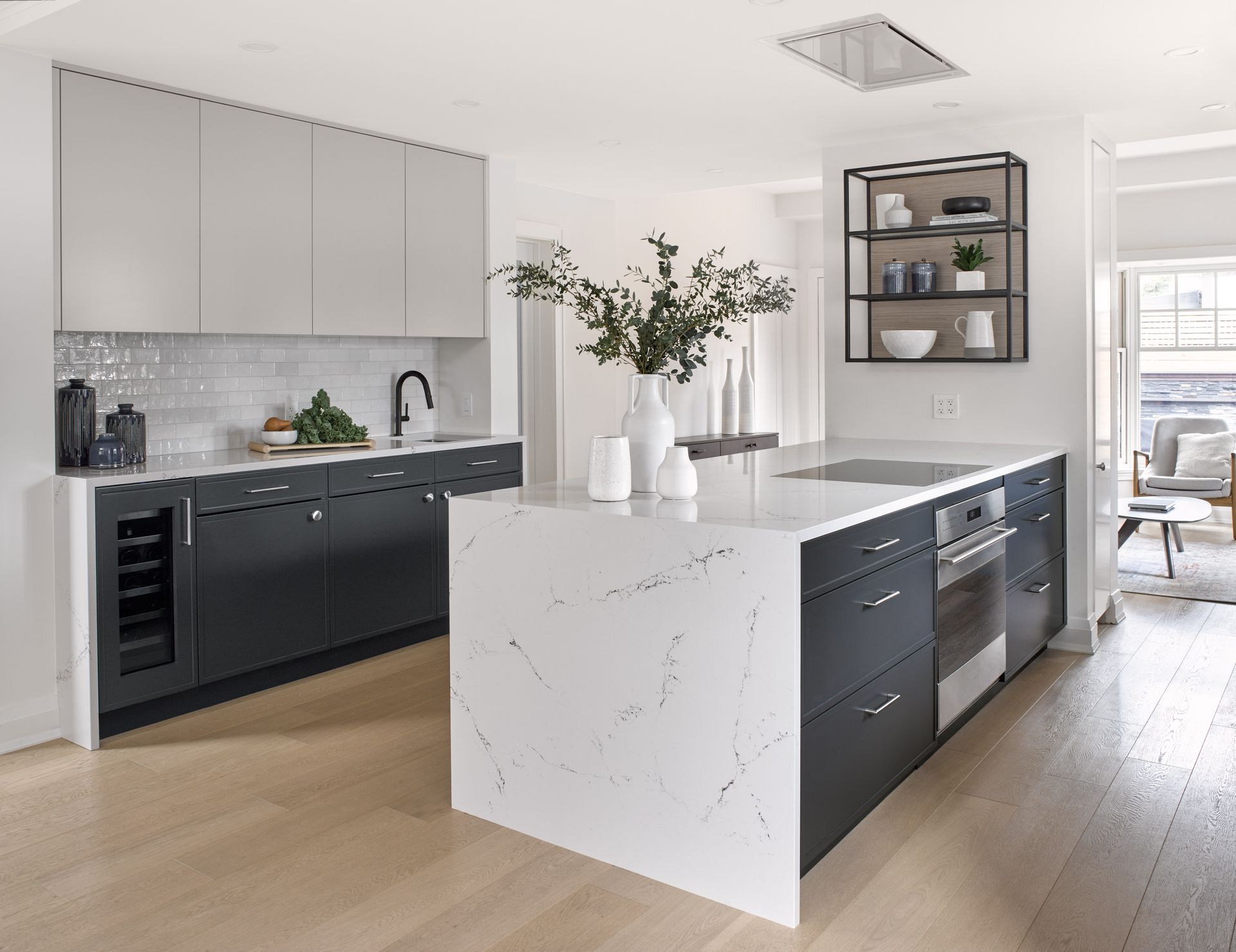 A kitchen with a large island in the middle of it.