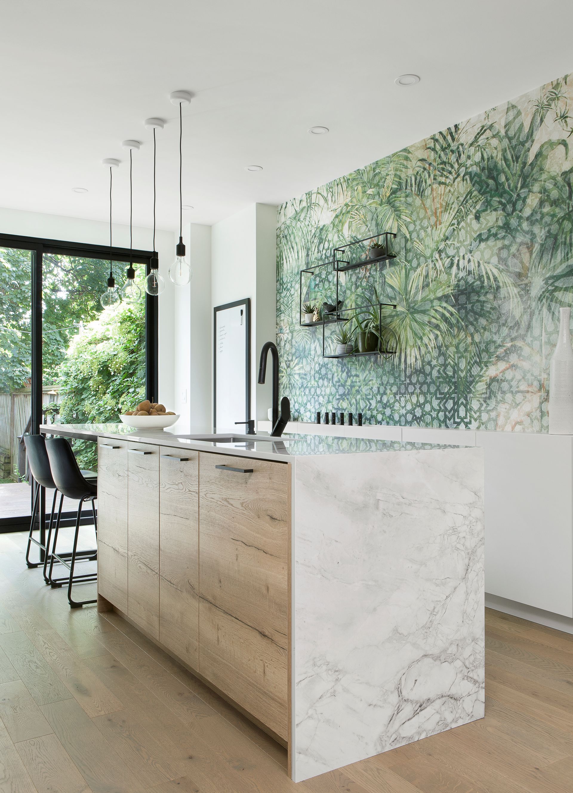 There is a large island in the middle of the kitchen.