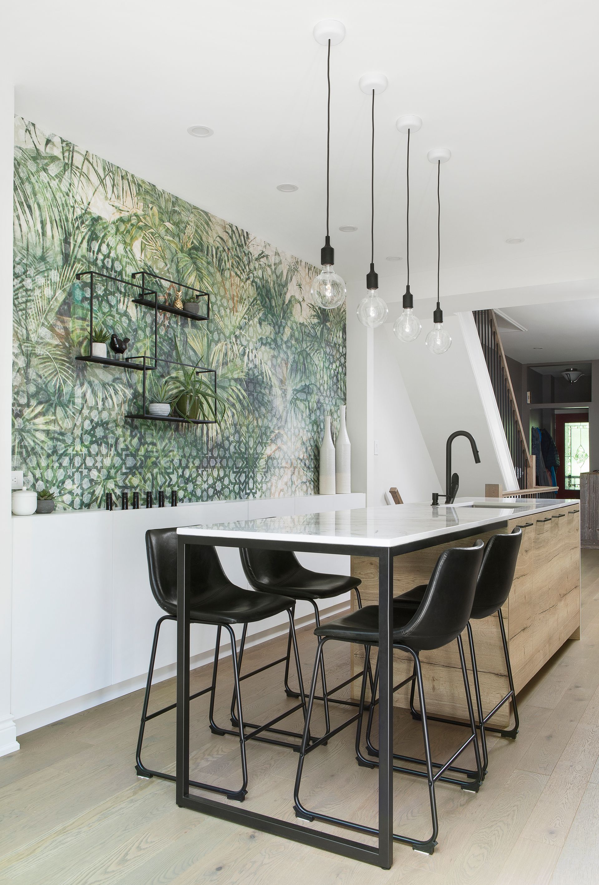 A kitchen with a table and chairs in it