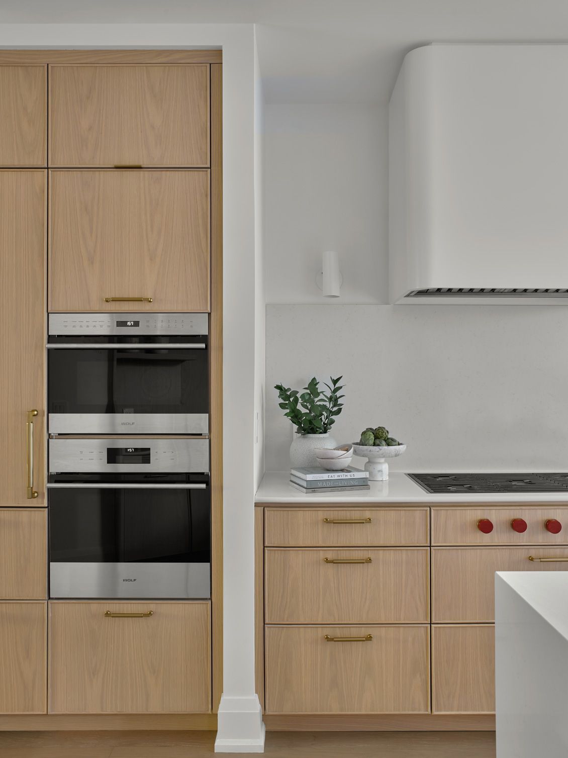 A kitchen with wooden cabinets and stainless steel appliances
