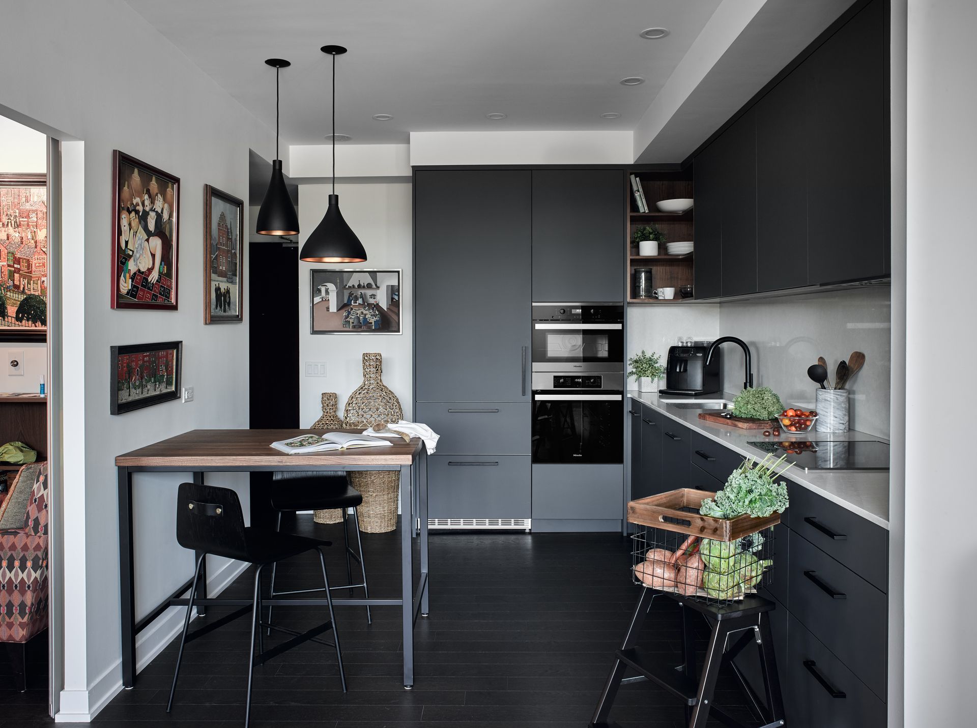 A kitchen with a table and chairs in it