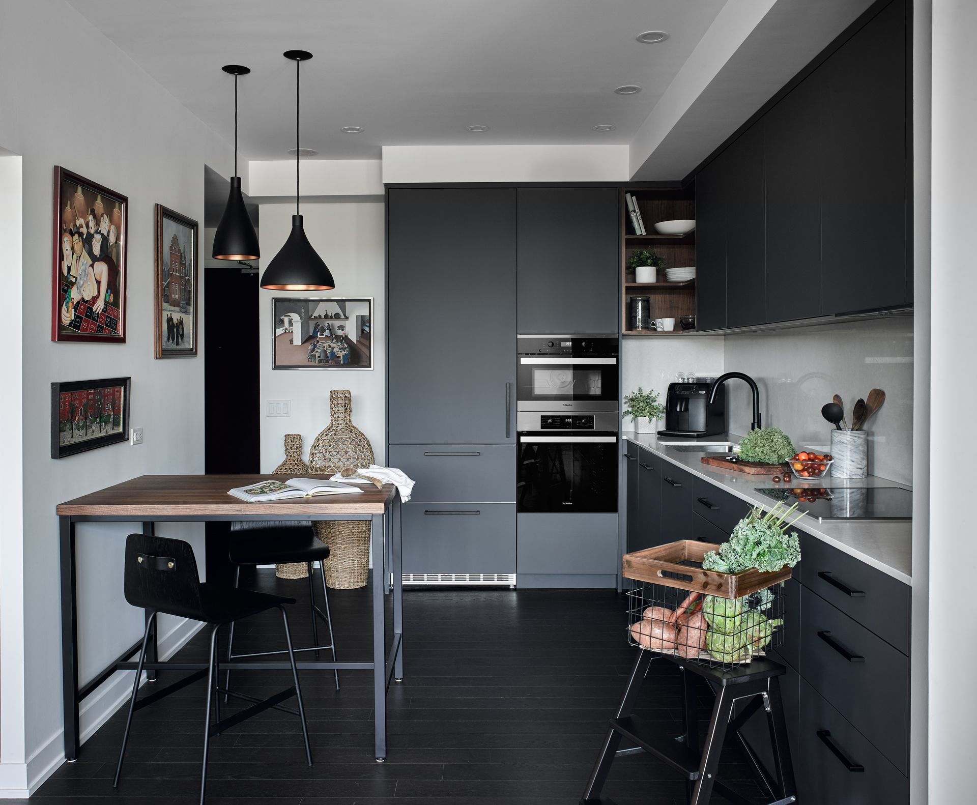 A kitchen with a table and chairs in it