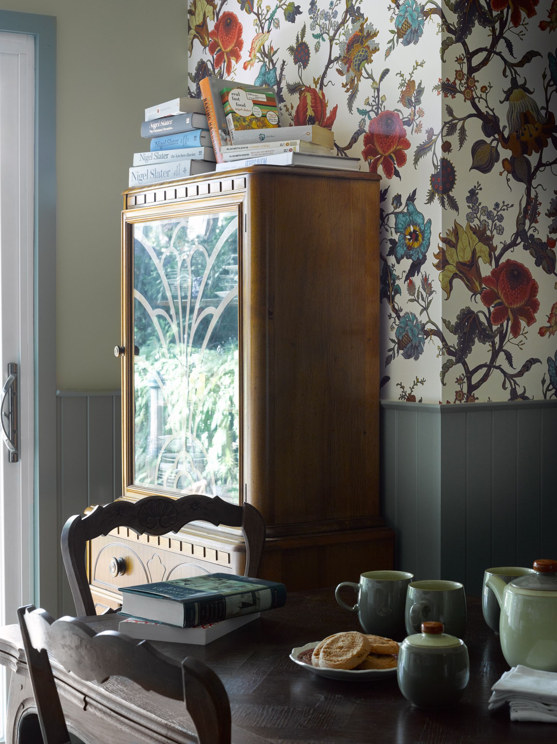 A table with a stack of books on top of it