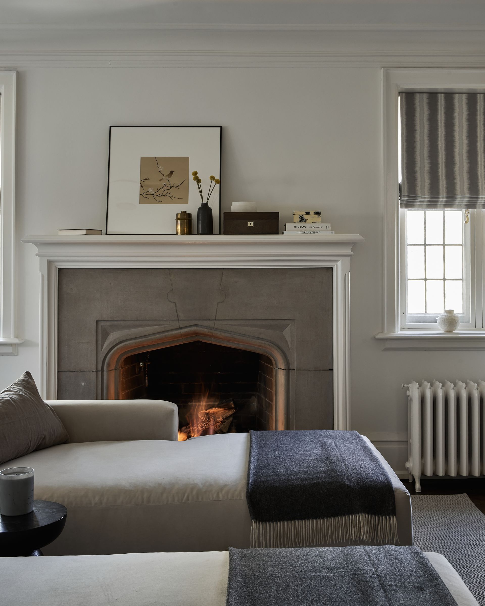 A living room with a fireplace and a couch