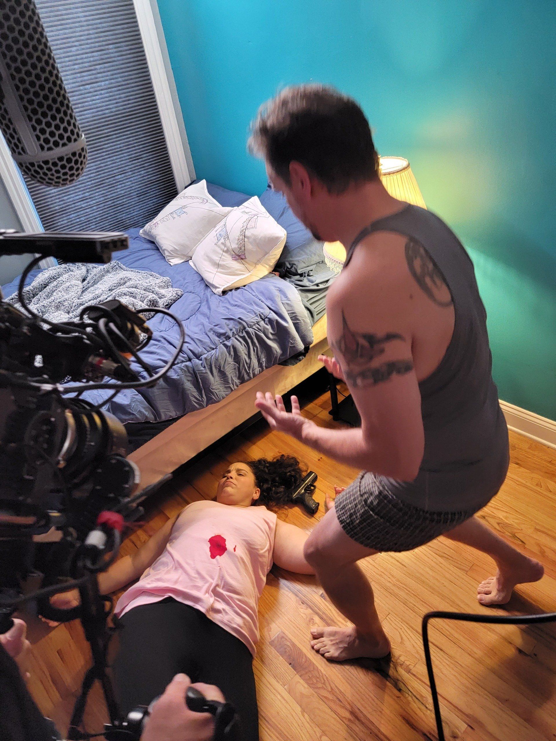 Actors Jaime Snyder and Gene Connelly rehearsing a death scene.