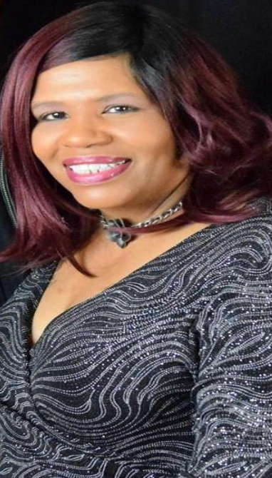 Jillian Bullock, director and writer of ‘A Cup Full of Crazy,’ posing next to the official movie poster featuring the lead characters and the tagline ‘When life starts to imitate art, someone won’t survive.