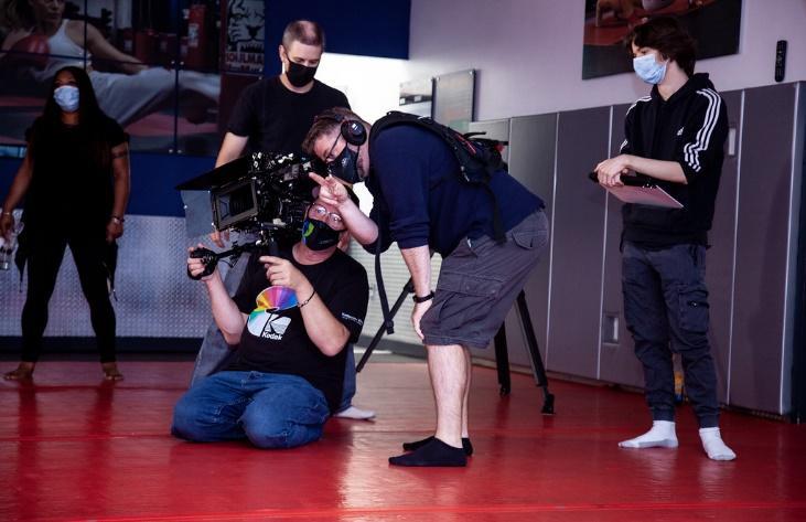 Director of Photography Craig Friebolin (holding camera) with crew