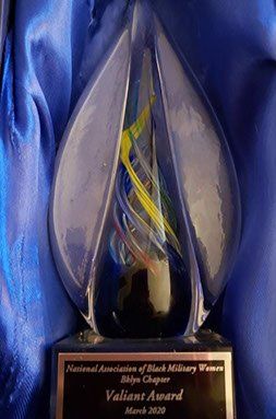 Close-up of the Valiant award, showcasing intricate glasswork design