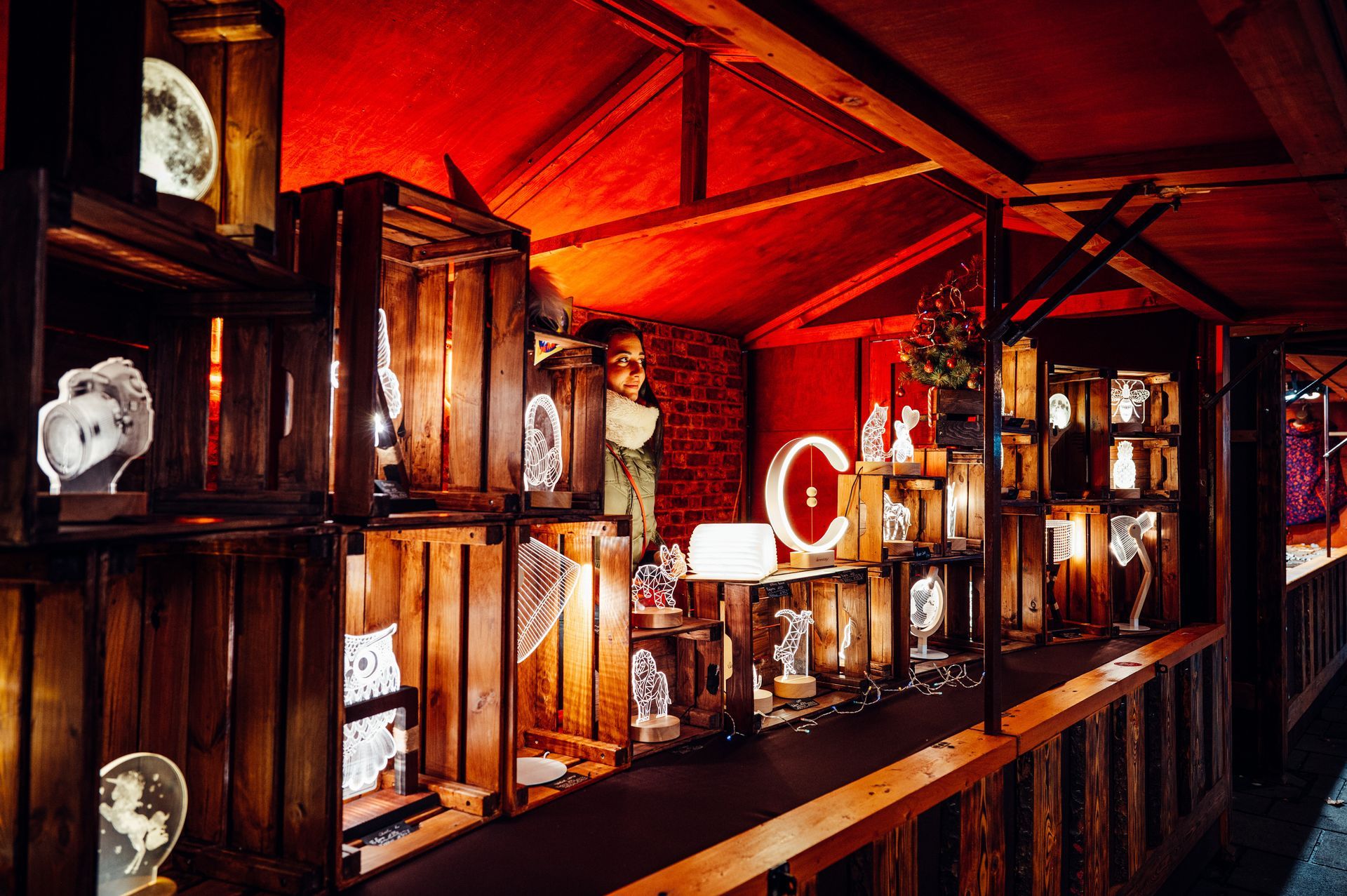 A row of wooden crates are lined up in a room