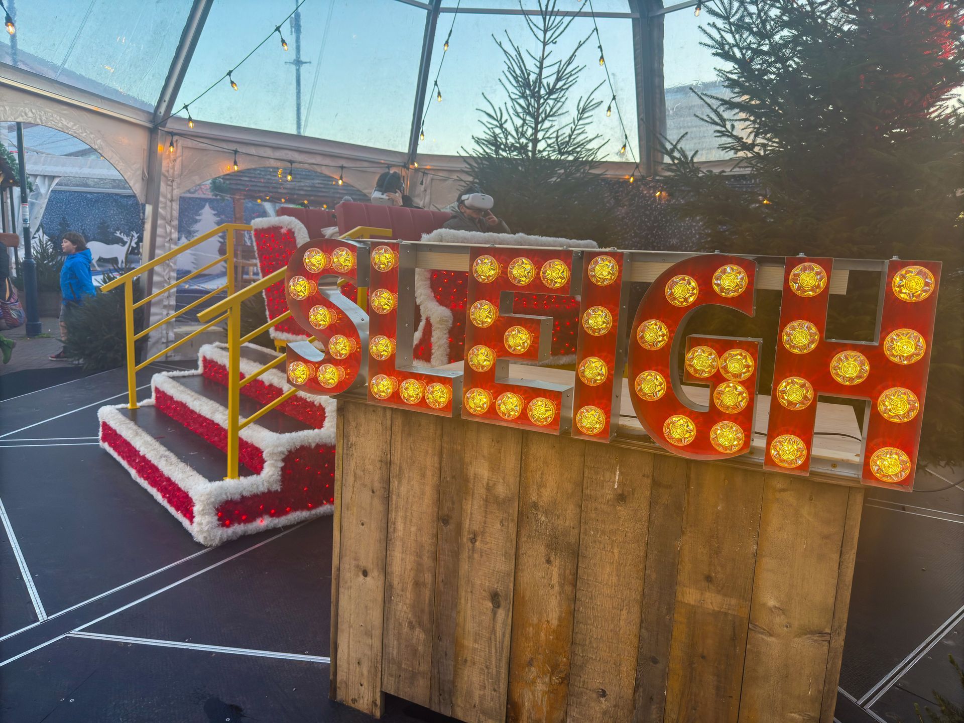 A wooden sign that says sleigh on it
