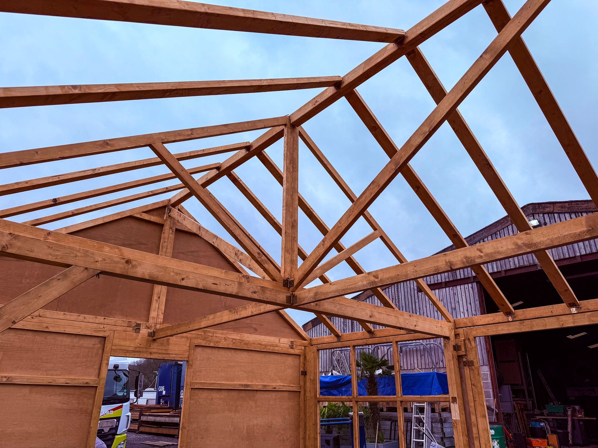 A wooden structure with a blue sky in the background