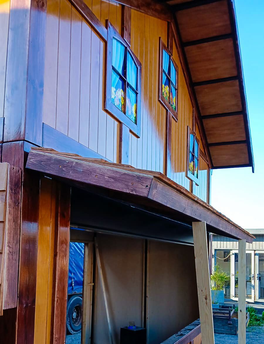 A wooden building with a blue sky in the background