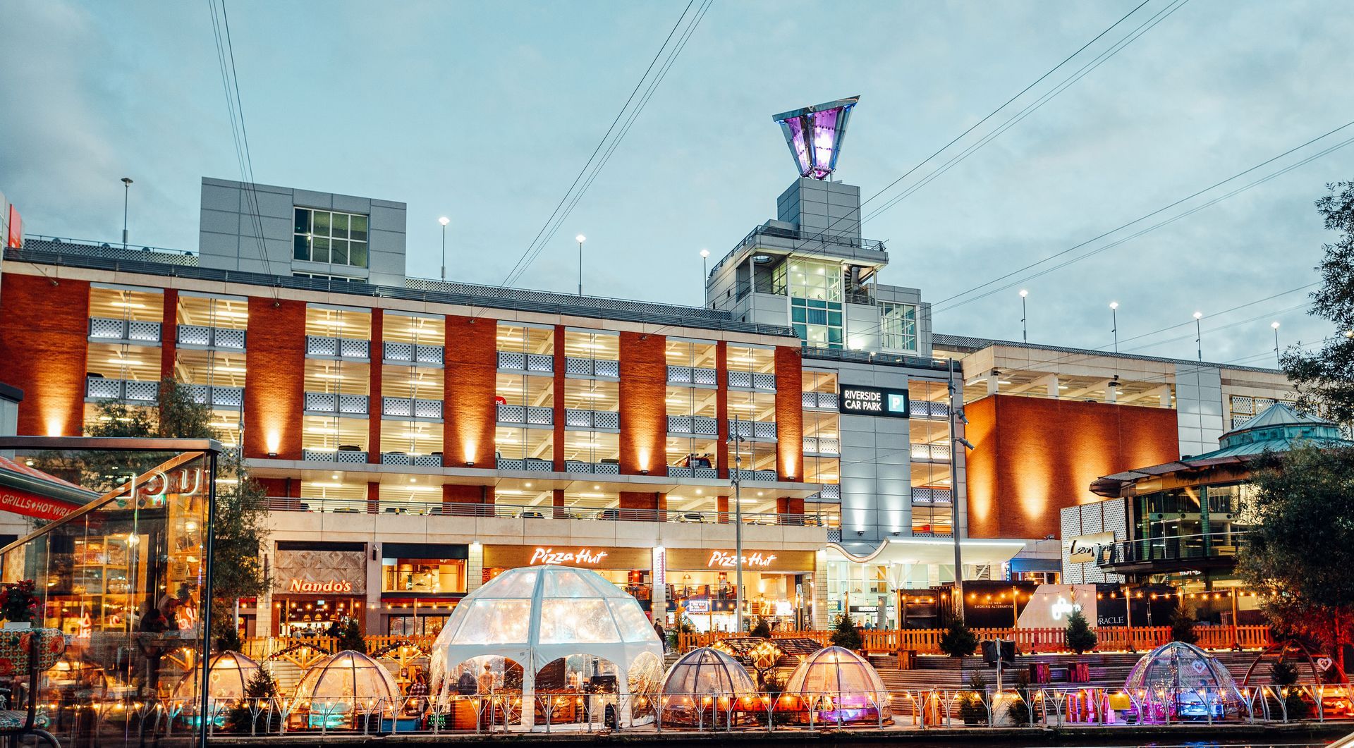 Dome tent in front of a large building