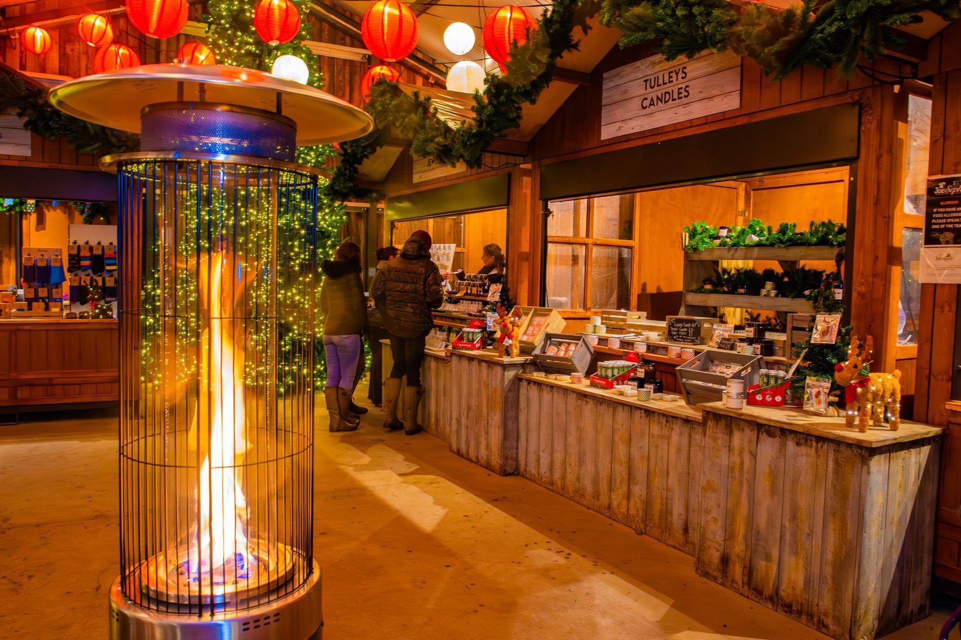 A heater with a fire inside of it at a market