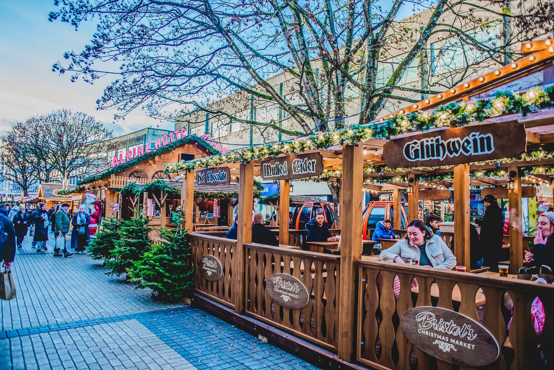 A christmas market with a sign that says glühwein